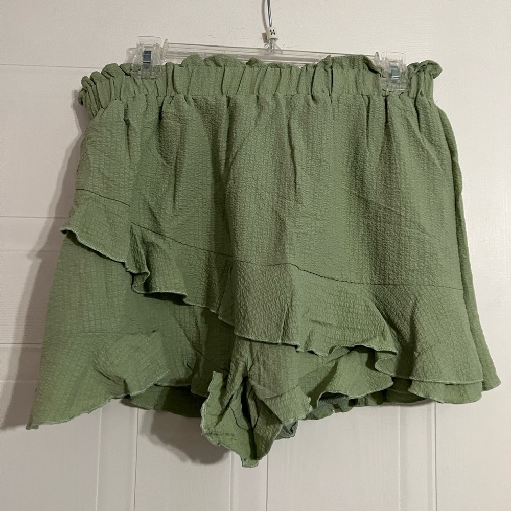 Sage green, stretchy, shorts in the back, skirt in the front